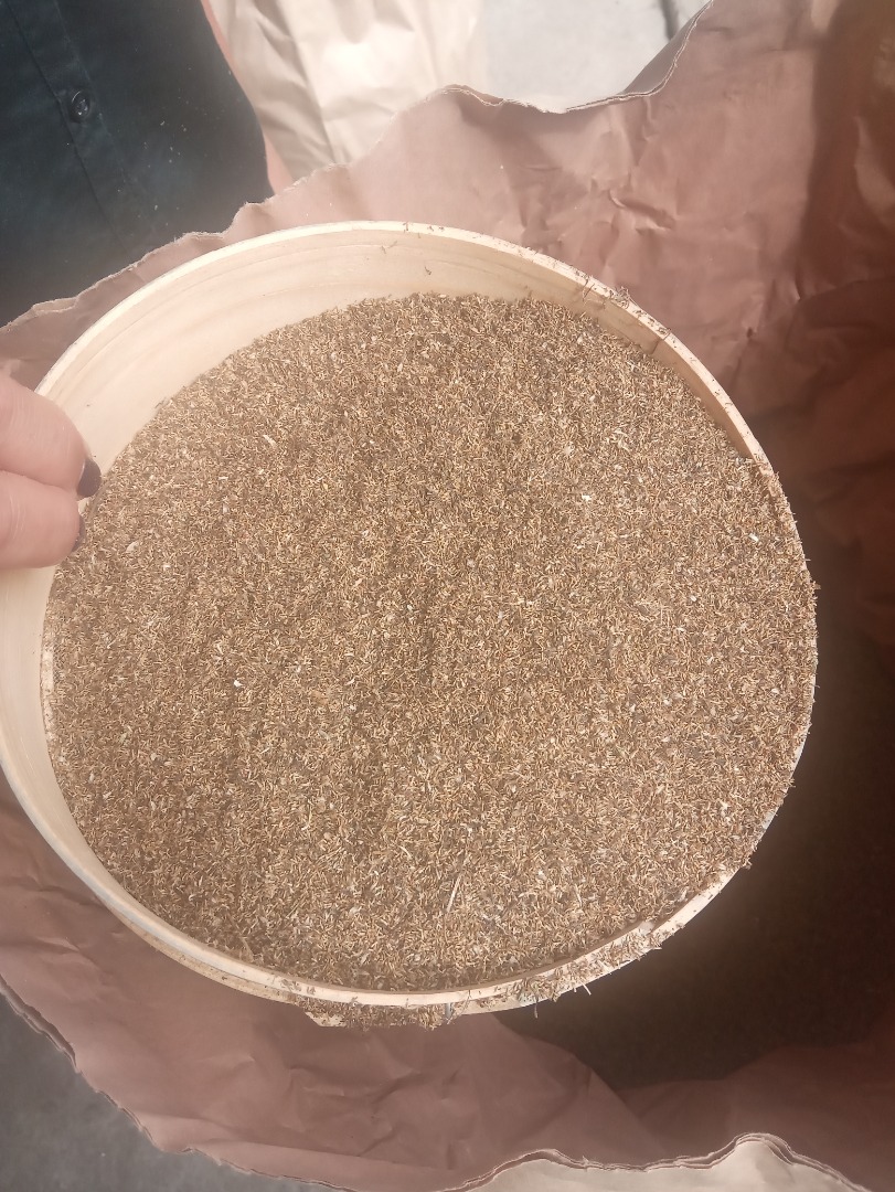 Camomile harvest for sale, July 2020 - traditionally dried in the sun, threshing combine