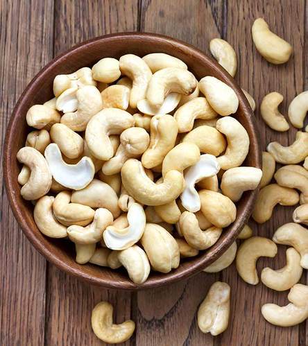 CASHEW NUTS The cashew tree is a tropical evergreen tree that produces the cashew seed and the cashew apple